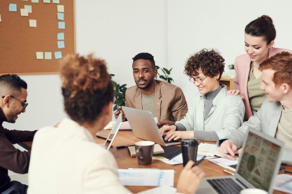 A group of employees having a meeting about customer lifetime value.